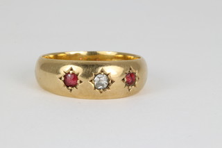 An 18ct ruby and diamond 3 stone gypsy ring, size J 1/2
