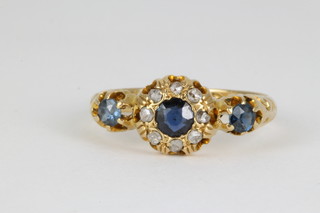 An Edwardian 18ct gold sapphire and diamond cluster ring, size N 1/2 