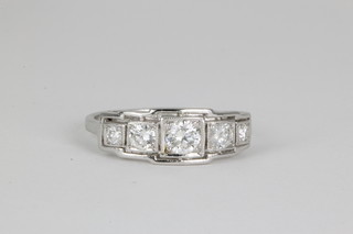 An 18ct white gold Art Deco style 5 stone brilliant cut diamond ring, size L