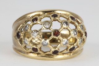 A 9ct gold high mount dress ring set with brilliant cut diamonds and gem stones, size N, 6 grams