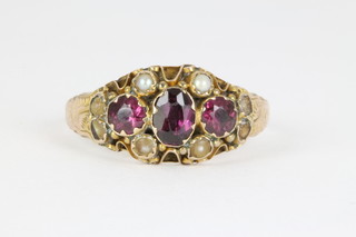 A 9ct Antique garnet and seed pearl ring