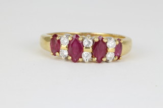 An 18ct yellow gold ruby and diamond ring size M 1/2