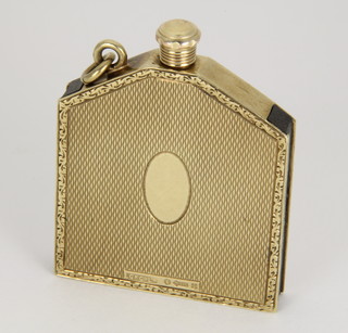 A novelty Art Deco engine turned gold lighter in the form of a car radiator grill