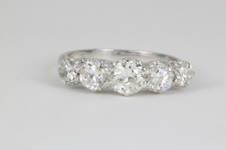 An 18ct white gold 5 stone diamond ring, approx. 1.8ct size O