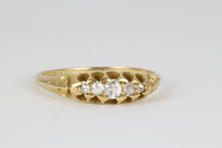 An 18ct yellow gold 5 stone graduated diamond ring size L 1/2