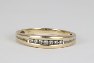 A 9ct channel set diamond ring, size Q 1/2