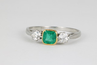 An 18ct emerald and diamond 3 stone ring, size P