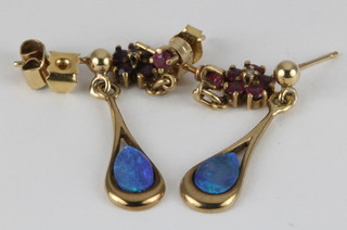 A pair of 9ct gold black opal earrings and a pair of ditto ruby earrings
