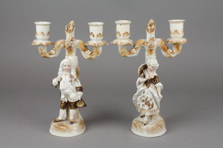 A pair of 19th Century Continental 2 light candelabra with figural bases 9" (f) 