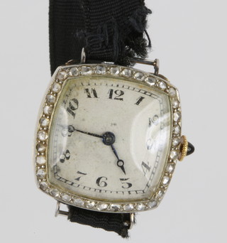 An Art Deco 18ct yellow gold cocktail wristwatch set with 36 diamond chips and a cabouchon set blue winder 