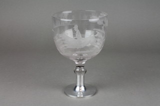 A cut glass wine goblet decorated with a fox hunting scene, now on an aluminium base 7" 