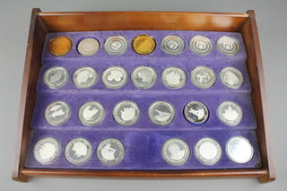 A Birmingham Mint collection of 26 Sterling proof medals "The Achievements of Her Majesty Queen Elizabeth II's Twenty Five Year Reign" approx. 1195 grams