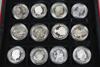 A Birmingham Mint commemorative set of 12 silver medals, approx 336 grams