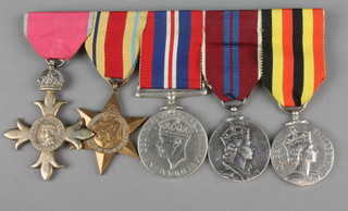 A group. OBE, Atlantic Star, British War medal, 1953 Coronation and Ugandan Independence medal 1962 