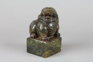 A carved soap desk seal in the form of a seated shi shi with 4 character mark 6" 