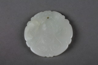 A carved jade pendant with geometric motifs 2.25", purchased at Liberty's and with original box 