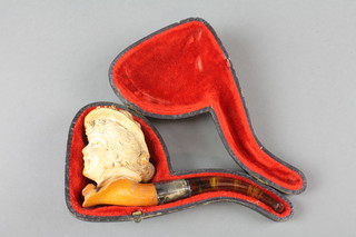 A Victorian carved Meerschaum pipe, the bowl in the form of a ladies head with amberoid mouth piece