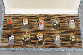 A set of 10 cased 1960's Japanese enamelled pendants
