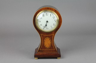 A bedroom timepiece with enamelled dial and Arabic numerals contained in an inlaid rosewood balloon shaped case