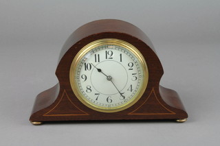 A French bedroom timepiece with enamelled dial and Arabic numerals contained in an arched shaped inlaid mahogany case 