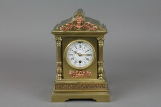 A French 19th Century 8 day timepiece with 2 1/2" porcelain dial and Roman numerals, contained in a gilt metal classical case 9" 