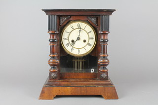 Unghans.  A 19th Century striking shop clock with paper dial and Roman numerals, contained in a mahogany case (missing finial)