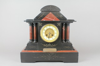A Victorian French 8 day striking mantel clock with porcelain dial and Arabic numerals contained in a 2 colour marble architectural case 