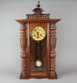 A 19th Century Vienna style striking regulator with 5 1/2" paper dial and Roman numerals and gridiron pendulum contained in a walnut case (missing finials to bottom)