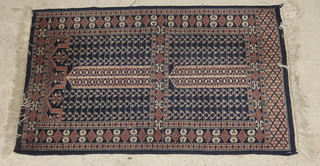 A blue ground Bokhara rug with all-over geometric design 38" x 25" 