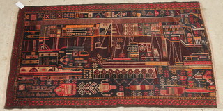 A pictorial Belouche rug with black and tan ground 55" x 34" 