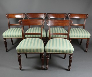 A set of 6 William IV mahogany bar back dining chairs with shaped mid rails, on turned and reeded supports 
