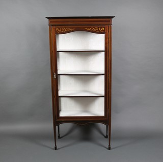 An Edwardian inlaid mahogany display cabinet with moulded cornice, the shelved interior enclosed by a glazed panelled door, raised on square tapering supports 60"h x 28 1/2"w x 14"d 