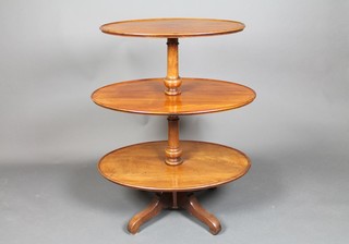 A Victorian oval mahogany 3 tier graduated dumb waiter, raised on a turned column with tripod base 40"h, bottom tier 32" x 21", middle 31" x 21" and top 26" x 16 1/2" 