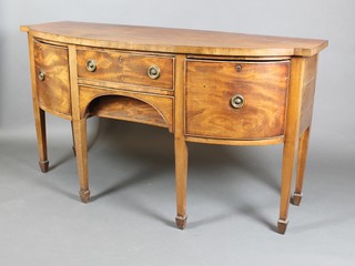 A Georgian mahogany bow front sideboard fitted 1 long drawer flanked by 2 short drawers, raised on square tapering supports, spade feet 35 1/2"h x 65"w x 25"d 