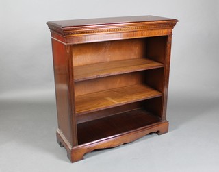 A Georgian style mahogany bookcase with moulded and dentil cornice, fitted shelves, raised on bracket feet 39"h x 37"w x 13 1/2"d