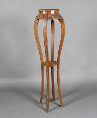A Chinese circular carved hardwood 2 tier jardiniere stand on cabriole supports 50"h x 10" diam. 