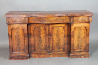 A Victorian mahogany breakfront sideboard of serpentine outline, the base fitted a cupboards enclosed by panelled doors 36"h x 65 1/2"w x 20"d 