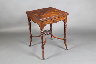A Victorian inlaid rosewood envelope card table fitted a drawer, raised on turned and fluted supports with X framed stretcher 29"h x 21 1/2"w x 21 1/2"d