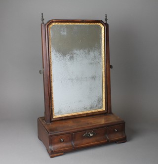 A Georgian arched plate dressing table mirror contained in a mahogany swing frame, the base fitted 1 long and 2 short drawers, raised on shaped bracket feet 21 1/2"h x 14 1/2"w x 8"d 