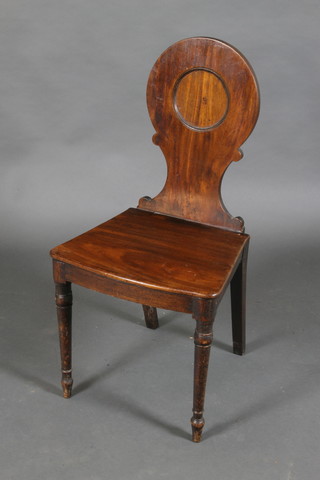 A Regency mahogany solid seat hall chair (old worm to base)