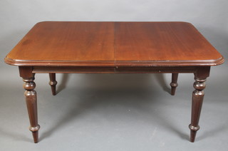 A Victorian style mahogany extending dining table with 1 extra leaf raised on turned and reeded supports 30"h x 44"w x 61"l when closed, 80" with extra leaf 