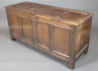 An 18th Century oak coffer of panelled construction with hinged lid and iron butterfly hinges 27 1/2"h x 58"w x 31"d 