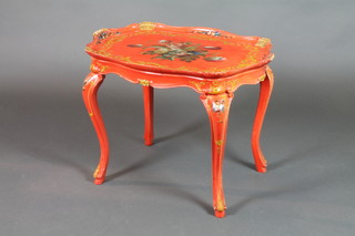 An Italian style shaped lacquered and floral patterned occasional table of serpentine outline raised on cabriole supports 20 1/2"h x 28 1/2"w x 19"d 