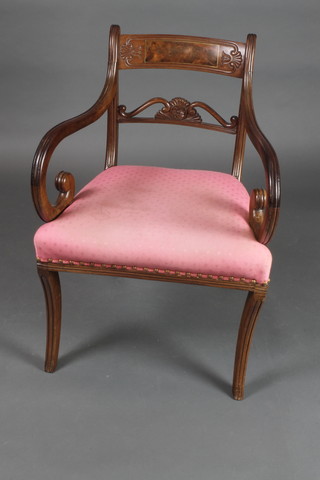 A Georgian carved mahogany bar back carver chair with upholstered seat, raised on sabre supports  
