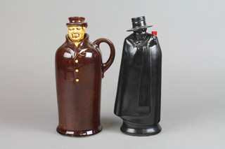 A 1920's brown glazed spirit decanter in the form of a 19th Century gentleman 10", a Royal Doulton Sandeman's port decanter 10" 