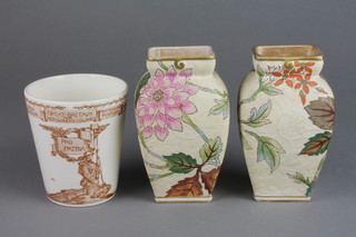 A Royal Doulton commemorative beaker Victory and Peace 1919 4", a pair of Doulton Slater flattened oviform vases decorated with flowers 5"
