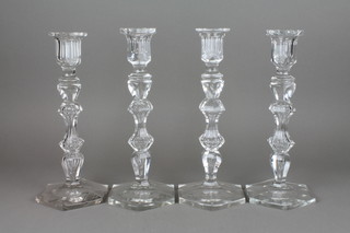 A set of 4 Baccarat style crystal candlesticks with waisted stems and hexagonal bases 11" 