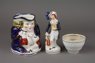 An 18th Century fluted teabowl with gilt decoration, a Staffordshire figure of a violinist (f) and a lustre jug 