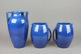 A pair of Branham Art Deco blue glazed jugs 8", a similar oviform vase