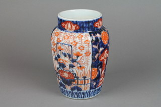 A 19th Century fluted oviform vase decorated with baskets of flowers 7" 